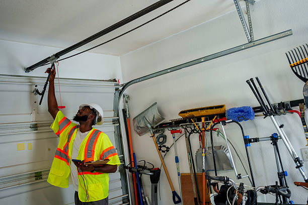 Professional Garage Door Panel Replacement technician working in West Concord, MA